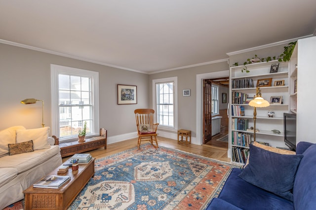 living room with crown molding and hardwood / wood-style floors