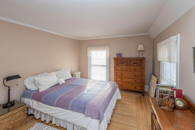 bedroom with crown molding and light hardwood / wood-style flooring