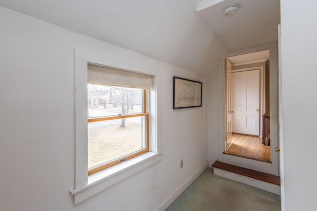 corridor with vaulted ceiling