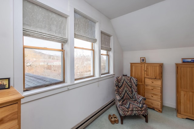 sitting room with light colored carpet and vaulted ceiling