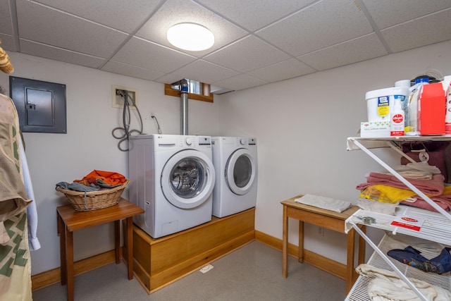 clothes washing area with independent washer and dryer and electric panel