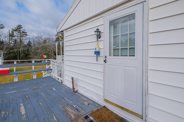 property entrance with a deck