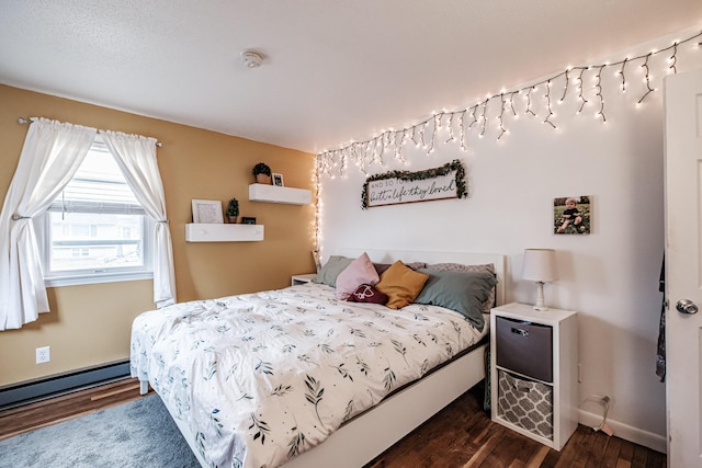 bedroom featuring a baseboard radiator and dark hardwood / wood-style floors