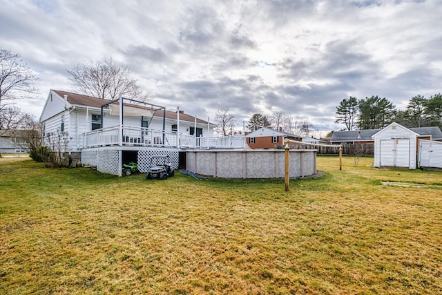 view of yard featuring a swimming pool side deck and a storage unit