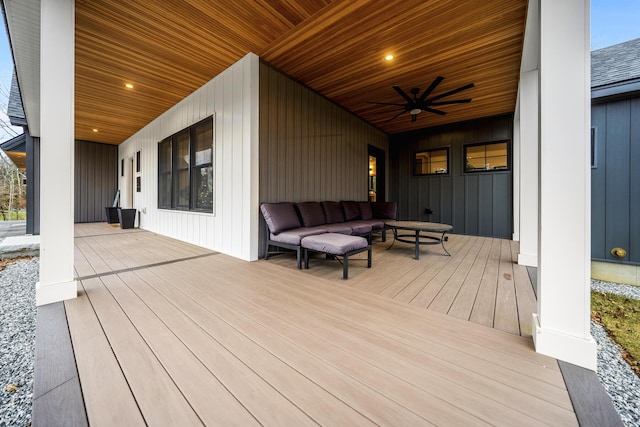 deck with covered porch, an outdoor hangout area, and ceiling fan