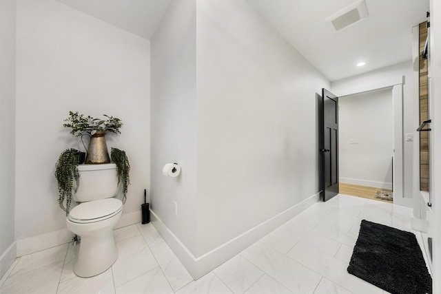 bathroom with tile patterned floors and toilet