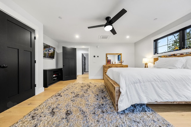 bedroom featuring ceiling fan and light hardwood / wood-style floors