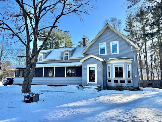 view of front of property with a sunroom