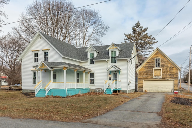 view of front of property with a front yard and a garage