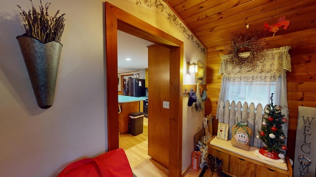 893 Horseback Rd, Levant, ME 04456 - hallway featuring wood finished floors, wooden walls, wooden ceiling, and recessed lighting