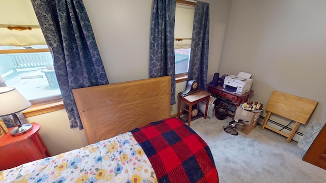 carpeted bedroom with baseboard heating