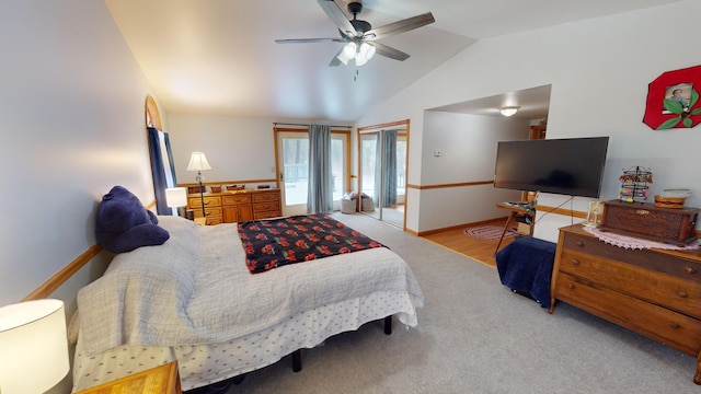 carpeted bedroom featuring ceiling fan and lofted ceiling