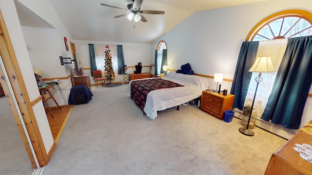 893 Horseback Rd, Levant, ME 04456 - carpeted bedroom featuring vaulted ceiling, a ceiling fan, and a baseboard radiator