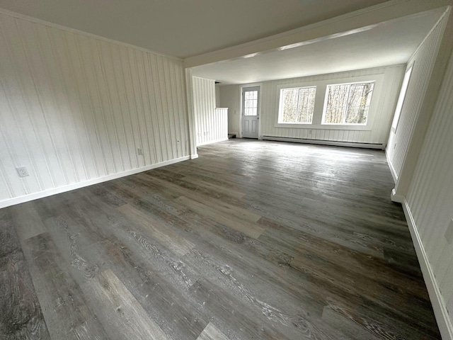 empty room featuring a baseboard radiator and dark wood-type flooring