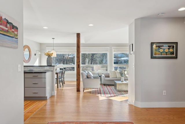 interior space with a chandelier and light wood-type flooring