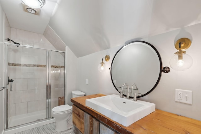 bathroom with tile patterned floors, toilet, walk in shower, and vanity