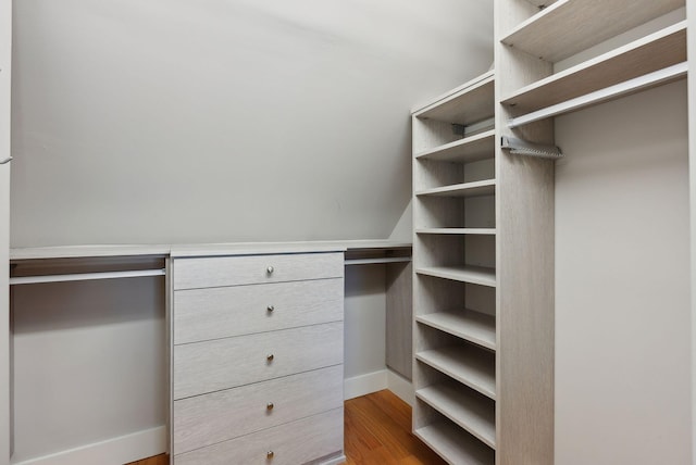 spacious closet with light hardwood / wood-style floors