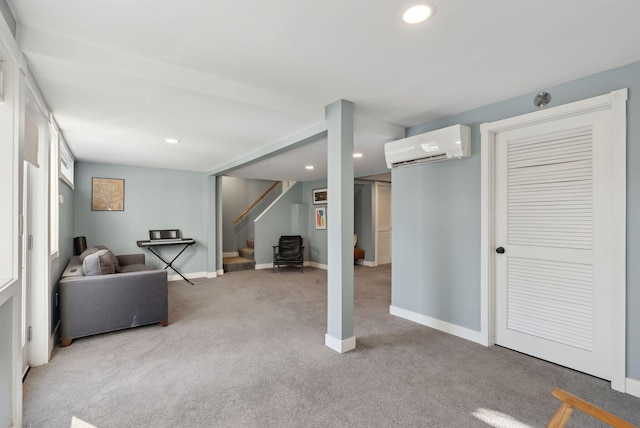 basement featuring a wall unit AC and light colored carpet