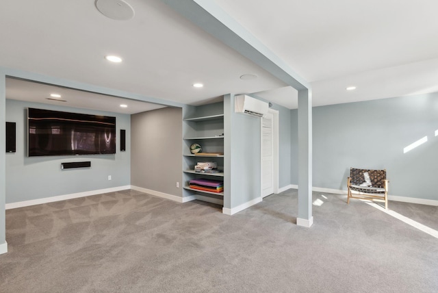 basement with light carpet, built in shelves, and a wall mounted air conditioner