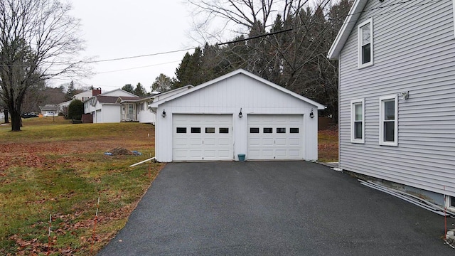 garage featuring a yard