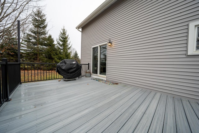 deck featuring a grill