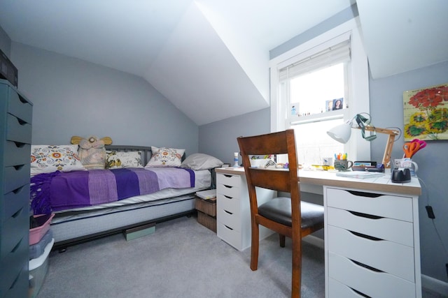 carpeted bedroom featuring lofted ceiling