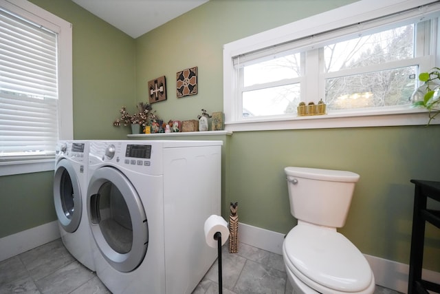 clothes washing area with independent washer and dryer