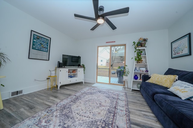 living room with ceiling fan and light hardwood / wood-style floors