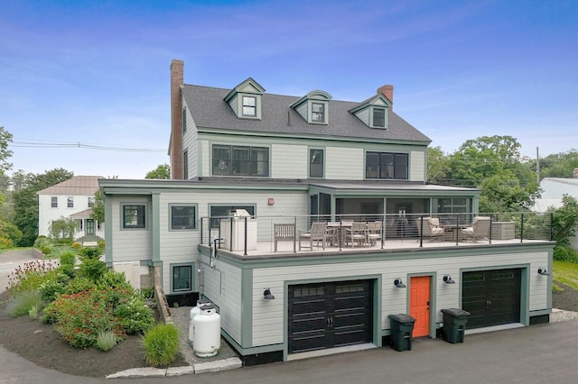 102 Main St, Belgrade, ME 04917 - view of front facade with a garage and a balcony