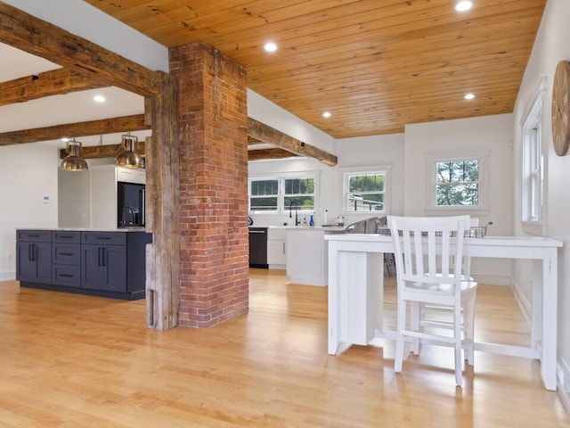 102 Main St, Belgrade, ME 04917 - kitchen featuring wood ceiling, light hardwood / wood-style flooring, dishwasher, white cabinets, and a breakfast bar area