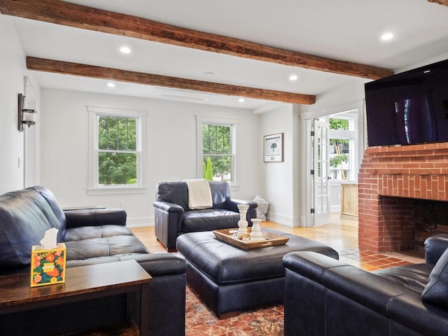 102 Main St, Belgrade, ME 04917 - living room with light wood-type flooring and a brick fireplace