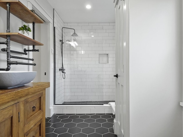 102 Main St, Belgrade, ME 04917 - bathroom with tile patterned floors, vanity, and tiled shower