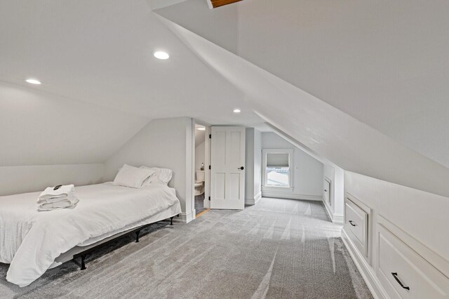 102 Main St, Belgrade, ME 04917 - bedroom with lofted ceiling, light carpet, and ensuite bath
