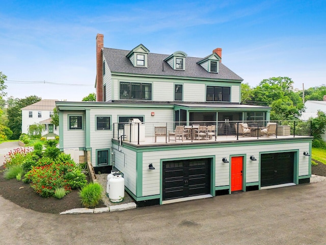 102 Main St, Belgrade, ME 04917 - view of front facade with a balcony and a garage