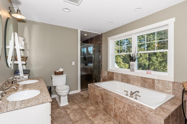 full bathroom with vanity, toilet, and separate shower and tub