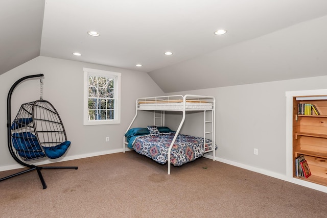 carpeted bedroom featuring lofted ceiling