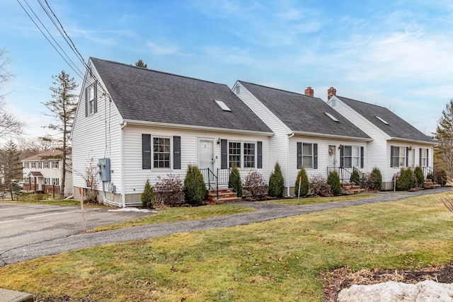 view of front of property with a front lawn