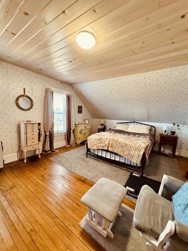 bedroom featuring wooden ceiling, wood-type flooring, and vaulted ceiling