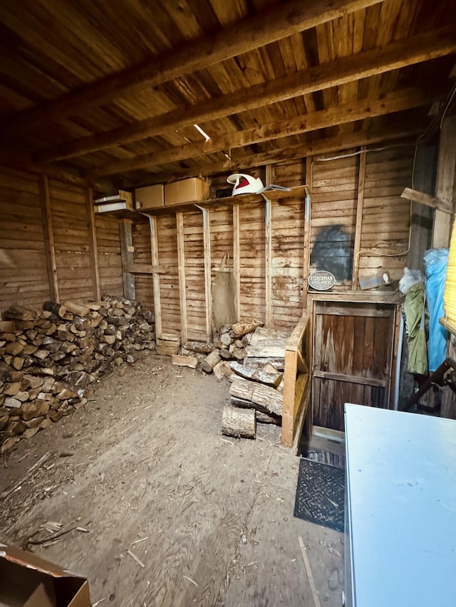 miscellaneous room with wood walls