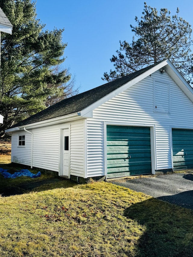 garage with a yard