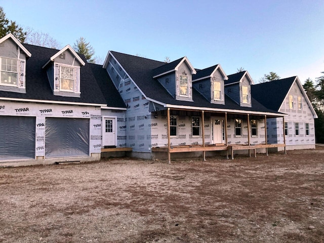 view of front of house with a porch and a garage