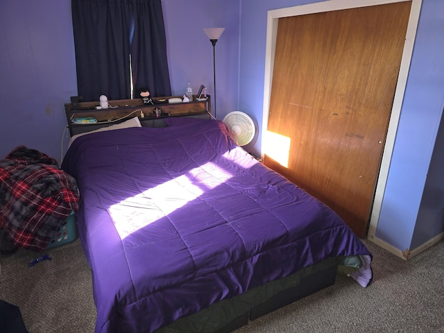 carpeted bedroom featuring a closet