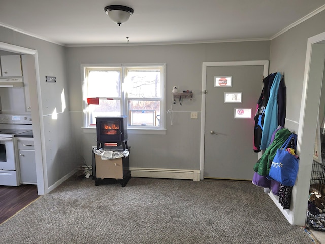 interior space with ornamental molding and a baseboard heating unit