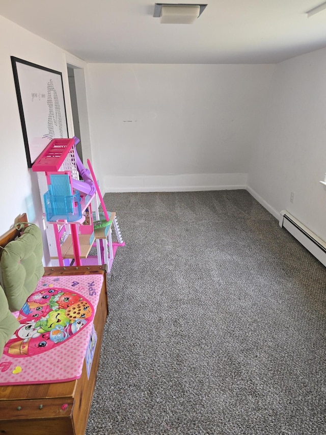 game room with dark colored carpet and a baseboard radiator