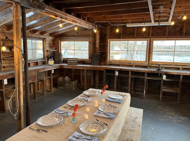 kitchen featuring wood walls and vaulted ceiling