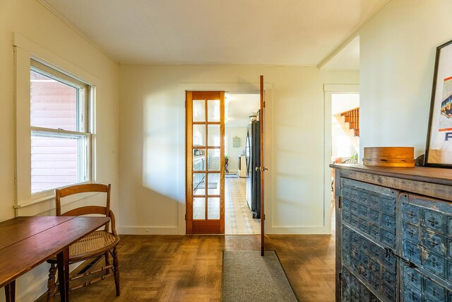 doorway featuring dark parquet flooring and french doors