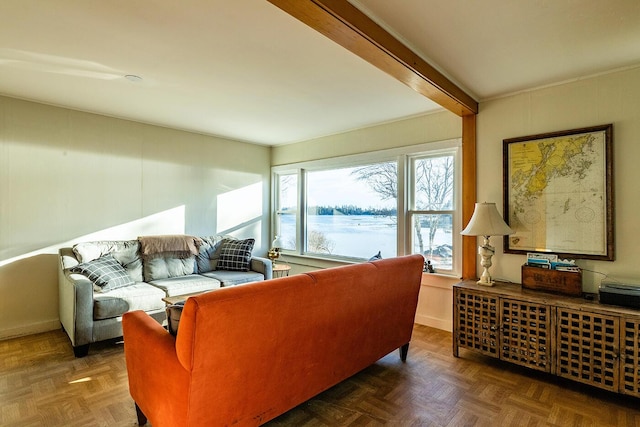 living room with beamed ceiling and dark parquet floors