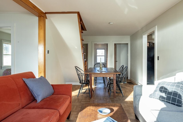 living room featuring dark parquet floors