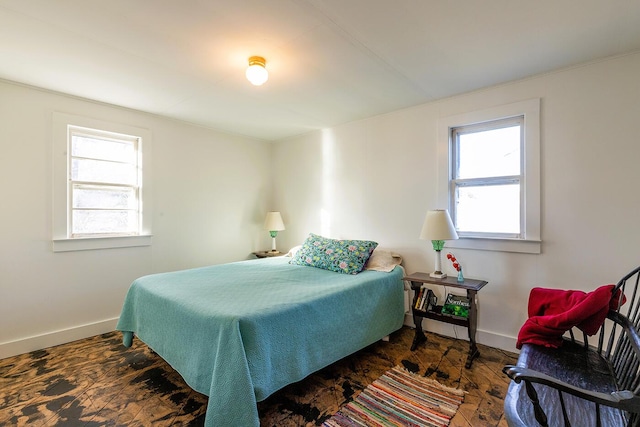 bedroom with dark hardwood / wood-style flooring