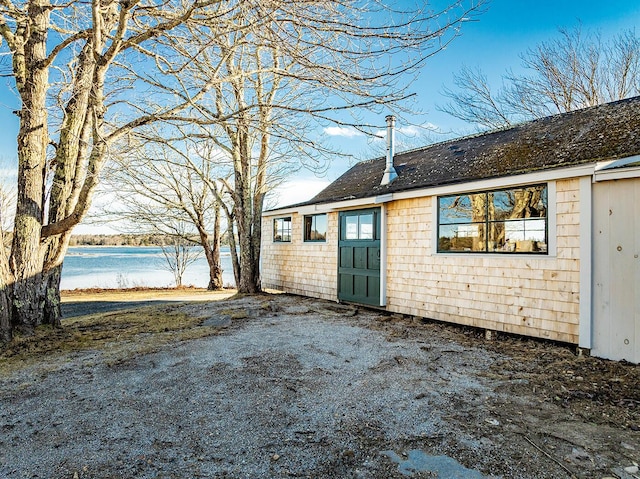 exterior space with a water view